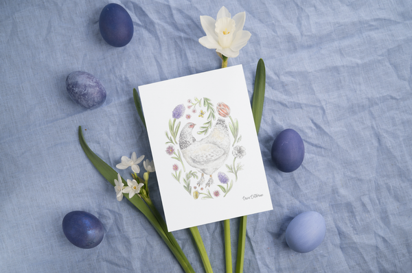 Print with floral design and chicken surrounded by Easter eggs and flowers on a textured blue background