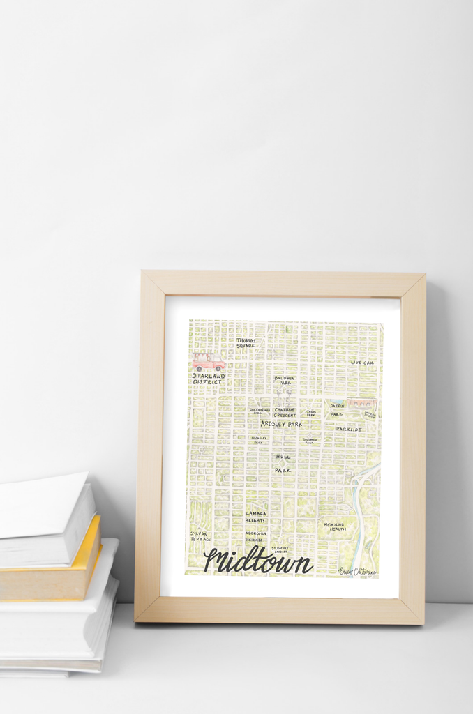 Framed map print of Midtown on a white surface with a light gray wall background