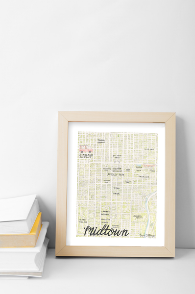 Framed map print of Midtown on a white surface with a light gray wall background