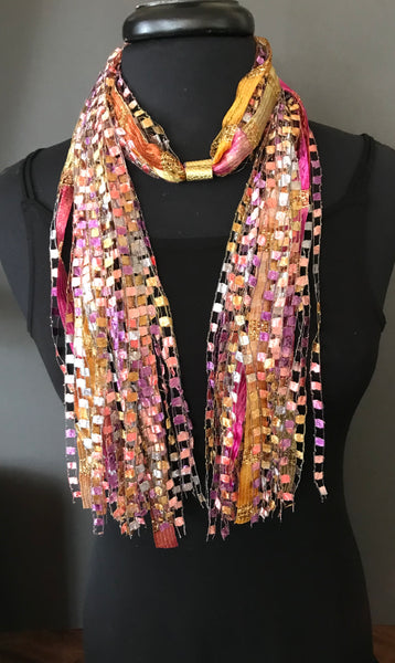pink and gold colored scarf necklace