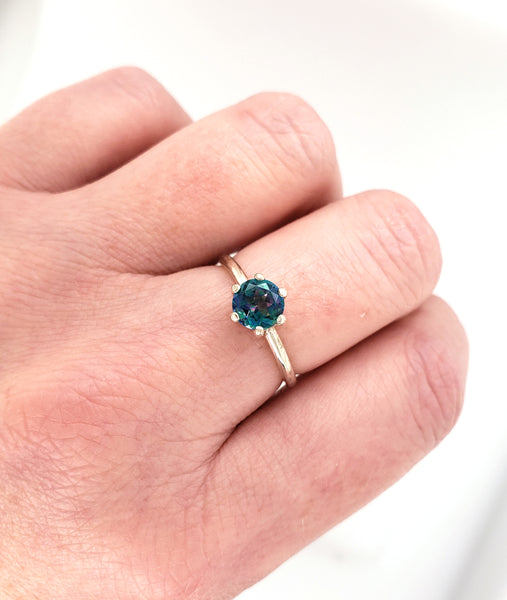 silver ring with blue topaz gemstone